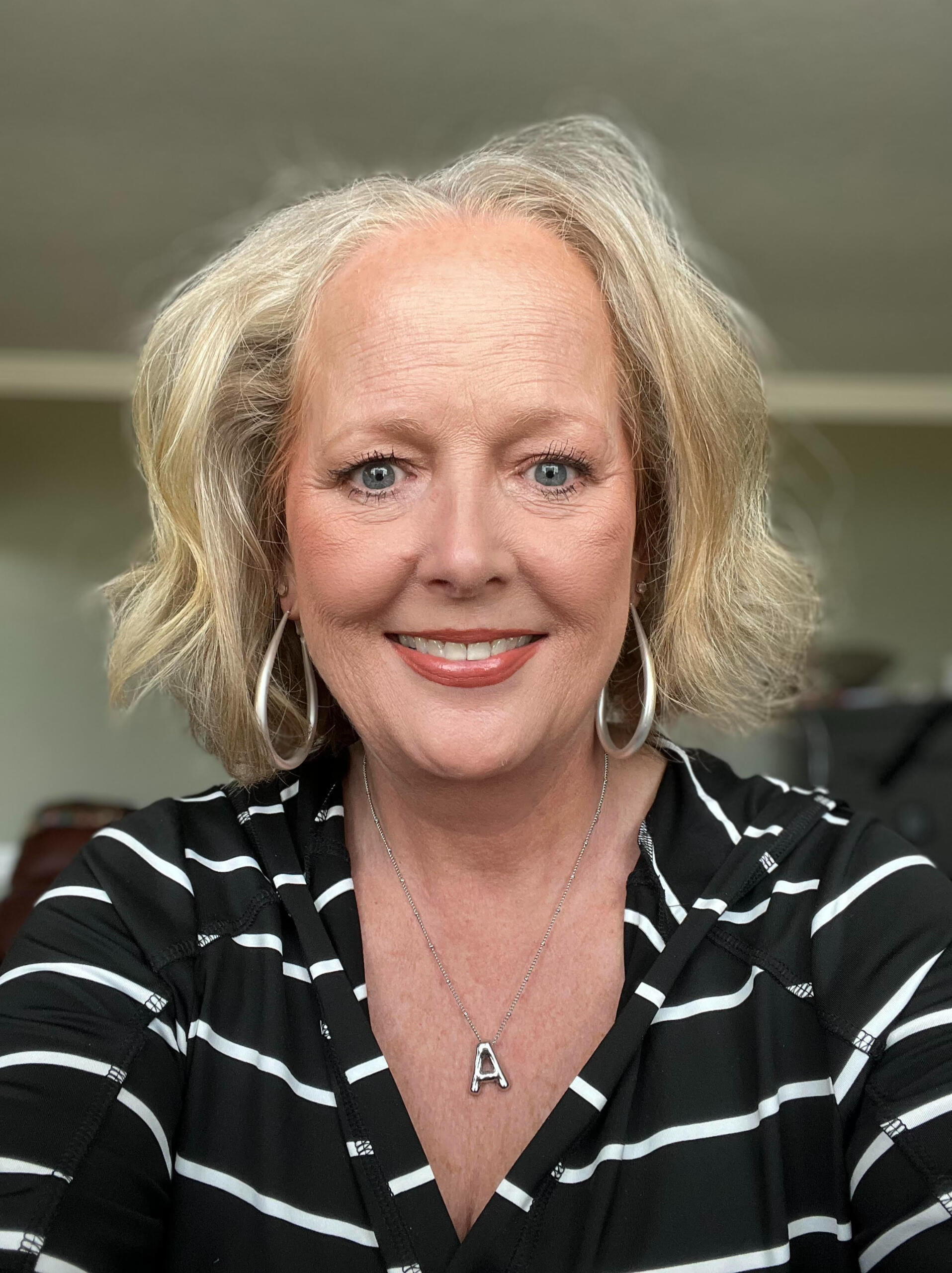 Ann Keller UGC Creator Ann Keller UGC Creator in a black and white striped top